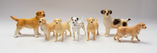 Collection of John Beswick mixed ceramic dog breeds.(7)