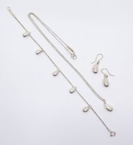 Tiffany & Co. a sterling silver Elsa Peretti  teardrop jewellery suite to include a pendant, chain
