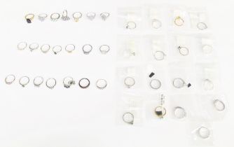 A collection of 38 silver to include various stone set rings, including stones such as tanzanite, (