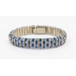 A vintage paste set blue stone white metal bracelet by Schreiber & Hiller, comprising channel set