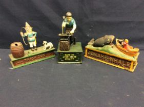 Three 20th century novelty painted metal money boxes one "Jonah and the Whale", "Trick Dog" and "