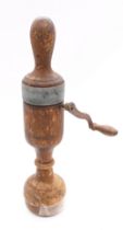 A late Victorian medical vibrator, made from turned wood with a metal handle, item rotates when