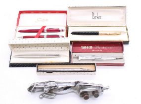 A collection of boxed vintage fountain and ball point boxed pens along with chrome Jaguar car bonnet