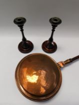 ***WITHDRAWN*** A pair of early 20th century mahogany and metal topped candlesticks, along with a