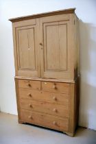 Antique pine Victorian linen cupboard on top of two above three chest of drawers.