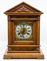 A Junghans large oak cased 19th/early 20th century bracket clock, with door opening to reverse to