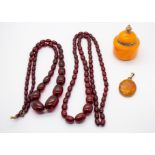 A cherry Bakelite/plastic coloured ovoid bead necklace, comprising graduated beads, along with a