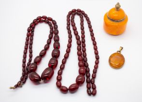 A cherry Bakelite/plastic coloured ovoid bead necklace, comprising graduated beads, along with a