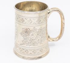 An Edwardian silver christening mug, chased floral and foliage design, with central oval cartouche