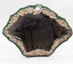 An Edwardian silver table mirror, cartouche shaped the frame chased with shells, scrolls, flowers