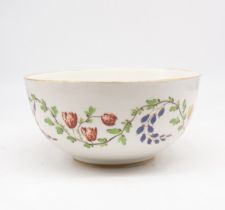 A European ceramic bowl, late 19th century, decorated with floral and foliage design. (Some signs of