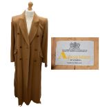 A classic ladies Aquascutum wool camel coat, in a double brushed design, hand stitched lapels, flap