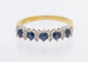 A sapphire and diamond 18ct gold half eternity ring, comprising a row of five round mixed cut