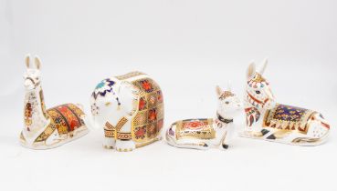 A collection of four Royal Crown Derby paperweights to include: Donkey, Donkey Foal, Llama and