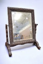 Victorian oak carved swing/toilet mirror carved in the 17th Century style bevel glass.