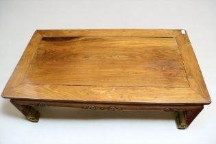 A 19th century Chinese hardwood occasional table, of low proportions and carved Chinoiseries detail,