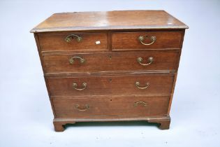 A George III oak chest of two above three chest of drawers along with another George III oak chest