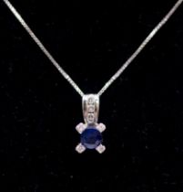A Sapphire and diamond 18ct white gold eight stone pendant with chain, approx 5mm round blue