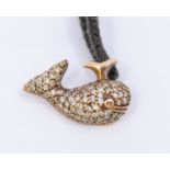 A diamond and pave set whale pendant on black adjustable cord necklet, pendant measures 16x10mm with