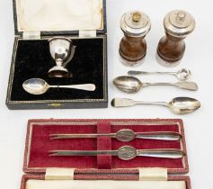 A collection of silver items to include; a cased set of two matching silver lobster picks,