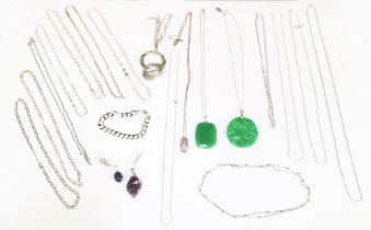 A collection of silver jewellery to include two jadeite pendants one of a carved form, both on