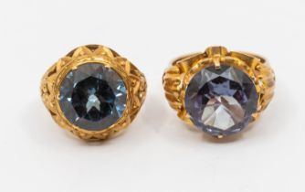 Two retro synthetic colour change sapphire gold rings, both comprising round mixed cut stones,