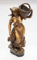 A large terracotta figure of a young lady with a wicker basket on her shoulder. Signed '