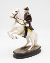 Beswick - A figure of a Lipizzaner horse and rider, marked to base and no. 53. On oval base.