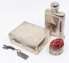 A collection of silver items to include; a George V silver small hip flask, of plain form, crest