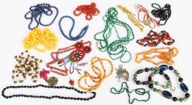 A collection of costume jewellery to include an amber bead necklace comprising a butterscotch