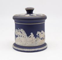 A small cylindrical Adams Tunstall jasperware lidded cigar pot with relief figural and rural