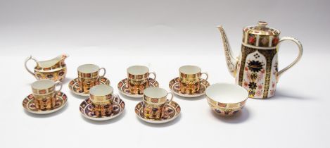 A Royal Crown Derby 1128 imari coffee set to include coffee cans, creamer, sugar, saucers and coffee