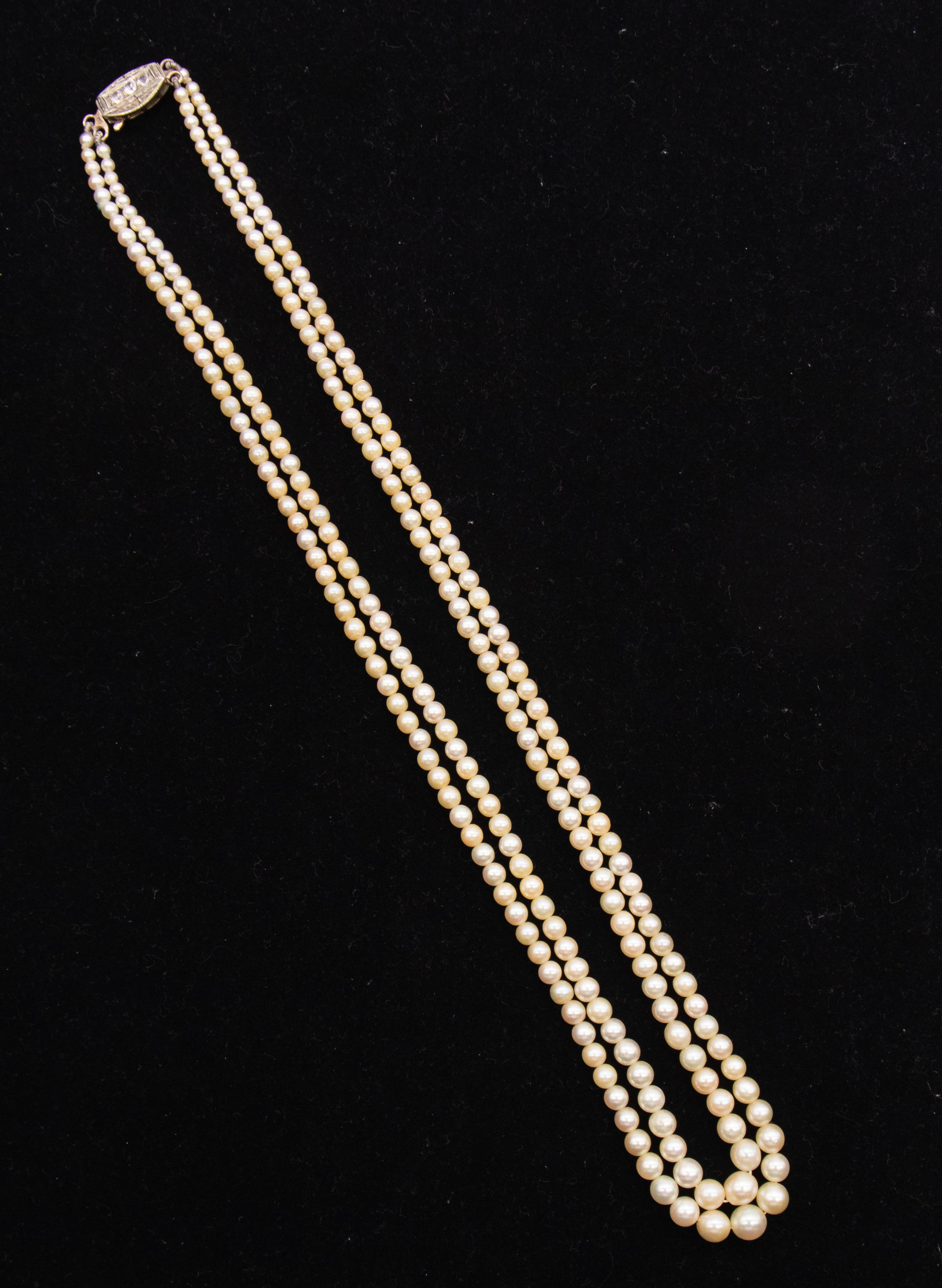 Two rows of graduated cream cultured pearls, from 6.2 - 2.6mm, not knotted with lengths of 480 and