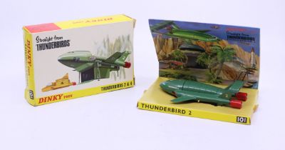 Dinky: A boxed Dinky Toys, Thunderbirds 2 & 4, Reference No. 101. Dark green body, yellow legs,