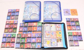 Pokemon: A collection of assorted Pokemon Topps cards; together with two folders with empty Staks