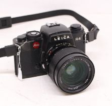 Leica: A Leitz Wetzlar, Leica R4 black camera body, Serial No. 1599322. With attached Leitz Vario-