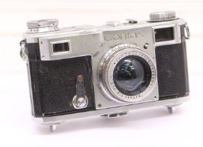 Contax: A Contax II Rangefinder camera body, circa 1940-42, Serial Number M31543. With attached Carl