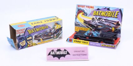 Corgi: A boxed Corgi Toys, Rocket Firing Batmobile with Batman and Robin, Reference No. 267.