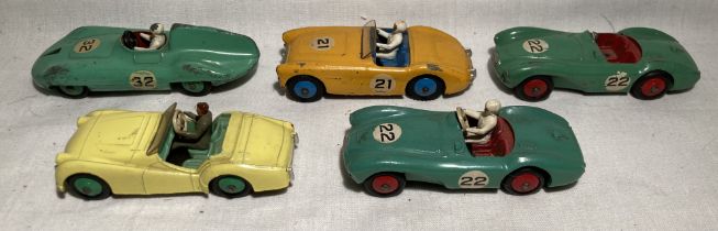 Dinky: A collection of five unboxed assorted Dinky Toys vehicles to include sports car. Appear in