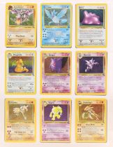 Pokemon: A complete Pokemon Unlimited Fossil Set, comprising 62/62 cards. Light whitening to some