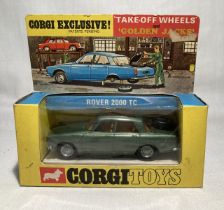 Corgi: A boxed Corgi Toys, Rover 2000 TC, Reference 275, with take off wheels and golden jacks.