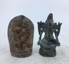 A small Indian bronze figure of Ganesh together with an Indian carved stone figure of a deity. (2)