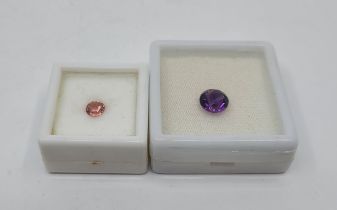A mixed round-cut amethyst, (EAW 2.4 carats), together with a mixed round-cut pink gemstone (EW 0.66