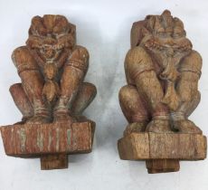 A near pair Asian carved wooden figures. (2)