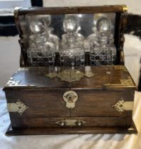 An early 20th cent games Tantalus complete with key, awarded to a member of the magic circle