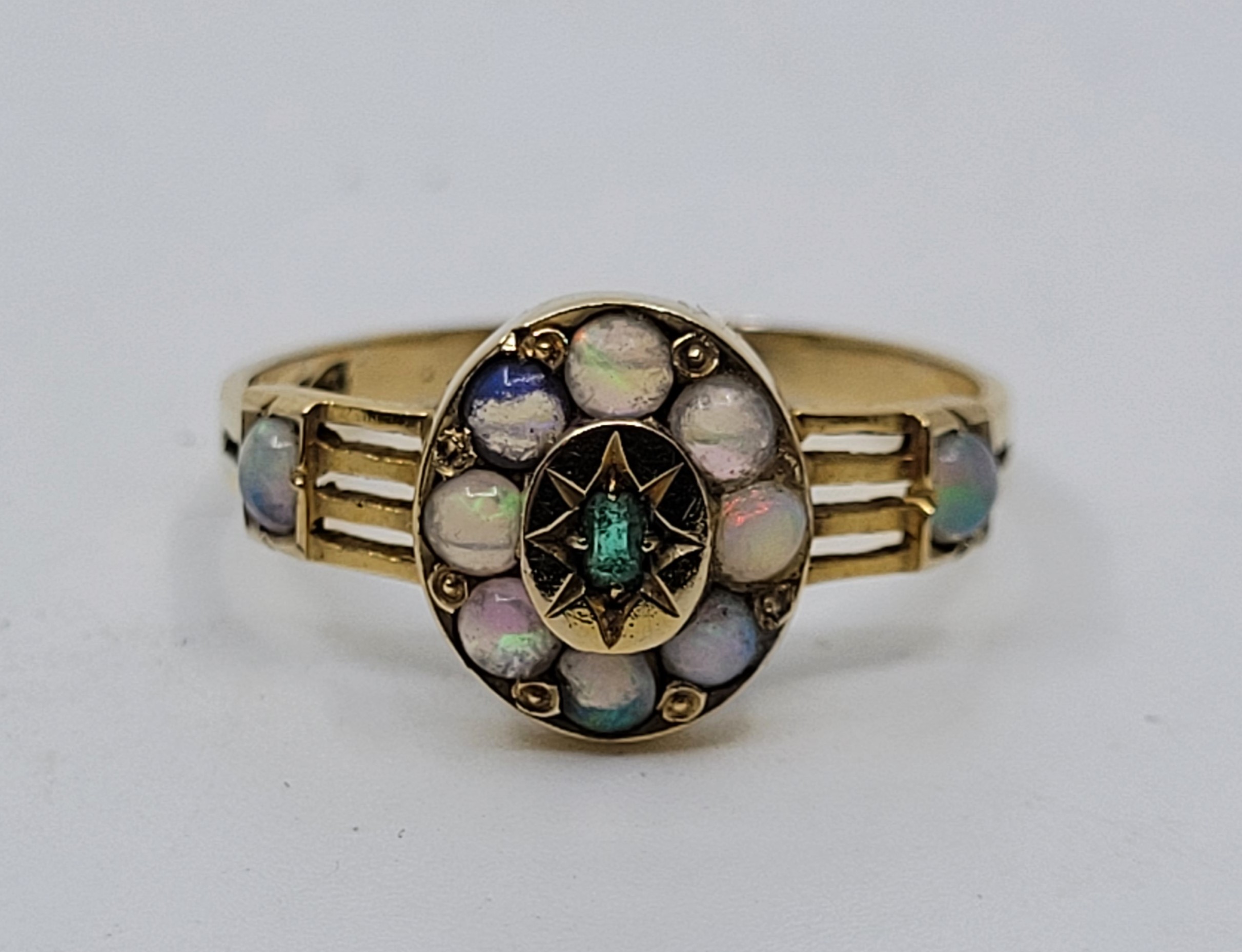 An 18ct gold, emerald and opal ring, the oval mount with raised centre illusion set single - Image 2 of 4