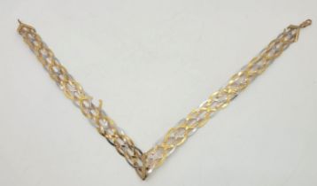 A tri-colour 9ct. gold choker necklace, fashioned from woven rose, yellow and white gold textured