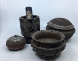 A collection of four Sino-Tibetan wooden items to include a Sino-Tibetan pestle and mortar, a Sino-