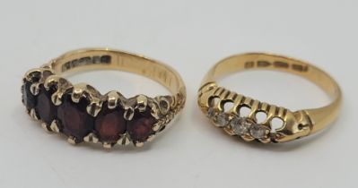 A 9ct. gold five stone garnet ring, set five graduated mixed oval cut garnets, size UK M 1/2 (