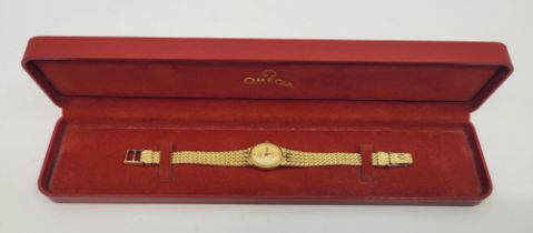 An Omega De Ville gold plated ladies' quartz bracelet watch, having signed oval gold plated dial